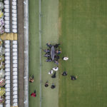 
              The coffin of Brazilian soccer great Pele is carried on the pitch of Vila Belmiro stadium where he will lie in state in Santos, Brazil, Monday, Jan. 2, 2023. (AP Photo/Matias Delacroix)
            