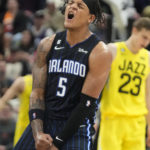 
              Orlando Magic forward Paolo Banchero (5) reacts after a teammate scored against the Utah Jazz during the second half of an NBA basketball game Friday, Jan. 13, 2023, in Salt Lake City. (AP Photo/Rick Bowmer)
            