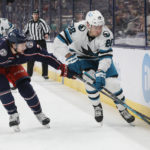 
              Columbus Blue Jackets' Andrew Peeke, left, and San Jose Sharks' Timo Meier chase a loose puck during the first period of an NHL hockey game on Saturday, Jan. 21, 2023, in Columbus, Ohio. (AP Photo/Jay LaPrete)
            