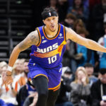 
              Phoenix Suns' Damion Lee (10) celebrates after a 3-point basket during the first half of an NBA basketball game against the Indiana Pacers in Phoenix, Saturday, Jan. 21, 2023. (AP Photo/Darryl Webb)
            