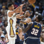
              New Orleans Pelicans guard CJ McCollum, left, passes the ball as Denver Nuggets forwards Jeff Green, front right, and Bruce Brown defend in the first half of an NBA basketball game Tuesday, Jan. 31, 2023, in Denver. (AP Photo/David Zalubowski)
            