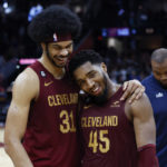 
              Cleveland Cavaliers guard Donovan Mitchell (45) celebrates with center Jarrett Allen (31) after an overtime win over the Chicago Bulls in an NBA basketball game, Monday, Jan. 2, 2023, in Cleveland. (AP Photo/Ron Schwane)
            