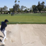 
              Davis Thompson hits from the bunker to the 12th green during the American Express golf tournament on the La Quinta Country Club Course Thursday, Jan. 19, 2023, in La Quinta, Calif. (AP Photo/Mark J. Terrill)
            