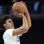 
              Phoenix Suns forward Cameron Johnson warms up for the team's NBA basketball game against the Minnesota Timberwolves, Friday, Jan. 13, 2023, in Minneapolis. (AP Photo/Abbie Parr)
            