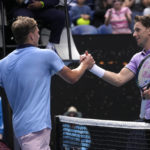 
              Jenson Brooksby, left, of the U.S. is congratulated by Casper Ruud of Norway following their second round match at the Australian Open tennis championship in Melbourne, Australia, Thursday, Jan. 19, 2023. (AP Photo/Dita Alangkara)
            