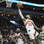 
              Toronto Raptors' Gary Trent Jr. shoots during the first half of an NBA basketball game Tuesday, Jan. 17, 2023, in Milwaukee. (AP Photo/Morry Gash)
            