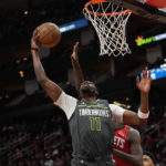 
              Minnesota Timberwolves' Naz Reid (11) shoots against the Houston Rockets during the first half of an NBA basketball game Sunday, Jan. 8, 2023, in Houston. (AP Photo/David J. Phillip)
            