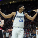 
              Dallas Mavericks guard Spencer Dinwiddie reacts after being fouled during the first half of an NBA basketball game against the Portland Trail Blazers in Portland, Ore., Sunday, Jan. 15, 2023. (AP Photo/Craig Mitchelldyer)
            
