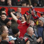 
              A fan cheers after Manchester United took the lead during the English Premier League soccer match between Manchester United and Manchester City at Old Trafford in Manchester, England, Saturday, Jan. 14, 2023. (AP Photo/Dave Thompson)
            