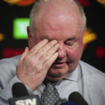 
              Vancouver Canucks coach Bruce Boudreau wipes his eye during a news conference after the team's NHL hockey game against the Edmonton Oilers on Saturday, Jan. 21, 2023, in Vancouver, British Columbia. (Darryl Dyck/The Canadian Press via AP)
            