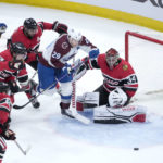 
              Colorado Avalanche's Nathan MacKinnon (29) loses control of the puck in front of Chicago Blackhawks goaltender Petr Mrazek during the first period of an NHL hockey game Thursday, Jan. 12, 2023, in Chicago. (AP Photo/Charles Rex Arbogast)
            