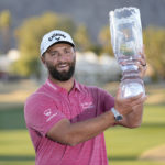 
              Jon Rahm hold the winner's trophy after the American Express golf tournament on the Pete Dye Stadium Course at PGA West Sunday, Jan. 22, 2023, in La Quinta, Calif. (AP Photo/Mark J. Terrill)
            