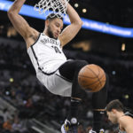 
              Brooklyn Nets' Ben Simmons dunks during the first half of the team's NBA basketball game against the San Antonio Spurs on Tuesday, Jan. 17, 2023, in San Antonio. (AP Photo/Darren Abate)
            