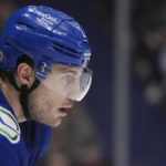 
              Vancouver Canucks' Luke Schenn lines up for a second-period faceoff against the New York Islanders awhile playing in his 900th career NHL hockey game, Tuesday, Jan. 3, 2023, in Vancouver, British Columbia. (Darryl Dyck/The Canadian Press via AP)
            