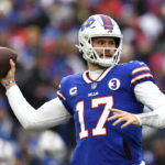 
              Buffalo Bills quarterback Josh Allen (17) passes during the first half of an NFL football game against the New England Patriots, Sunday, Jan. 8, 2023, in Orchard Park. (AP Photo/Adrian Kraus)
            