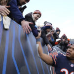 
              Chicago Bears running back David Montgomery, right, leaves the field after an NFL football game against the Minnesota Vikings, Sunday, Jan. 8, 2023, in Chicago. The Vikings won 29-13. (AP Photo/Nam Y. Huh)
            