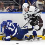 
              Los Angeles Kings defenseman Sean Durzi (50) knocks down Tampa Bay Lightning left wing Alex Killorn (17) during the second period of an NHL hockey game Saturday, Jan. 28, 2023, in Tampa, Fla. (AP Photo/Chris O'Meara)
            