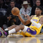 
              Los Angeles Lakers forward Rui Hachimura tries to pass after grabbing a loose ball during the first half of an NBA basketball game against the San Antonio Spurs Wednesday, Jan. 25, 2023, in Los Angeles. (AP Photo/Mark J. Terrill)
            