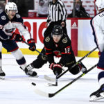 
              Ottawa Senators left wing Tim Stutzle (18) tries to keep control of the puck from the poke check of Columbus Blue Jackets left wing Eric Robinson (50) during the second period of an NHL hockey game, Tuesday, Jan. 3, 2023 in Ottawa, Ontario. (Justin Tang/The Canadian Press via AP)
            