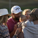 
              Jon Rahm hugs his family after winning the American Express golf tournament on the Pete Dye Stadium Course at PGA West Sunday, Jan. 22, 2023, in La Quinta, Calif. (AP Photo/Mark J. Terrill)
            