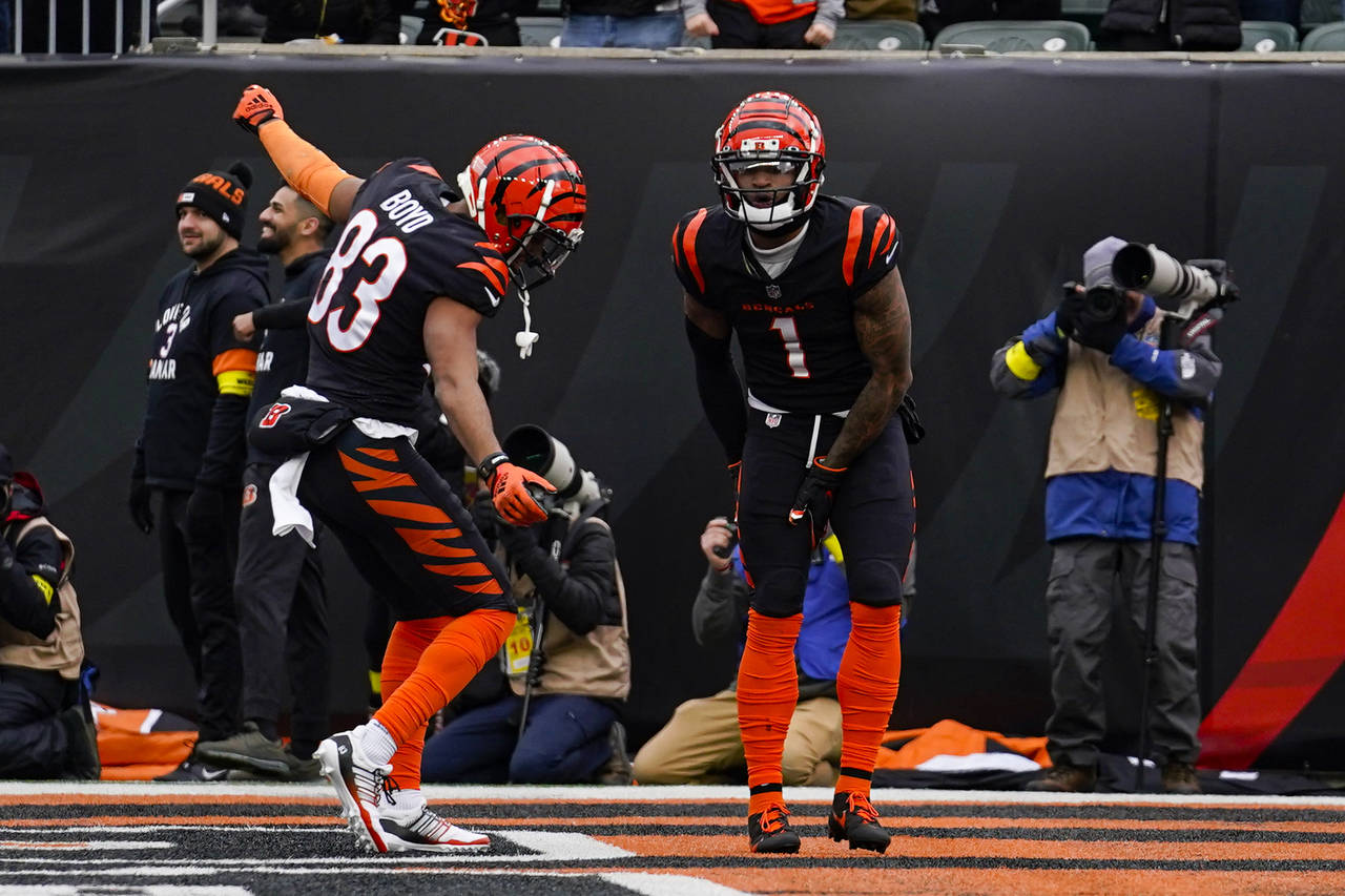 Cincinnati Bengals wide receiver Ja'Marr Chase (1) celebrates with Tyler Boyd (83) after a touchdow...