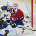 
              St. Louis Blues' Alexey Toropchenko (13) moves in on Montreal Canadiens goaltender Jake Allen during the first period of an NHL hockey game Saturday, Jan. 7, 2023, in Montreal. (Graham Hughes/The Canadian Press via AP)
            