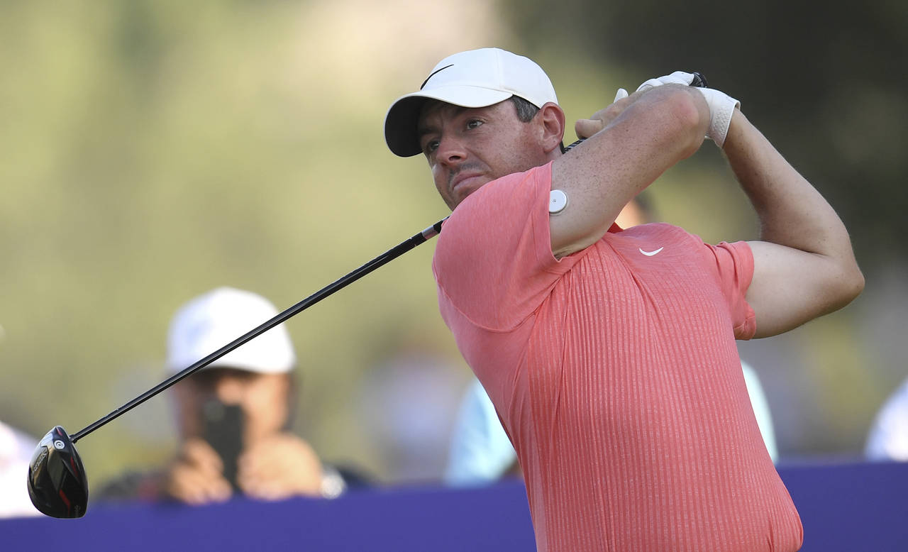 FILE - Rory McIlroy of Northern Ireland tees off at the 18th hole during DP World Tour Championship...