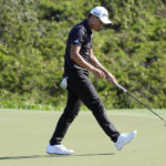 
              Collin Morikawa watches his putt on the 18th green during the final round of the Tournament of Champions golf event, Sunday, Jan. 8, 2023, at Kapalua Plantation Course in Kapalua, Hawaii. (AP Photo/Matt York)
            