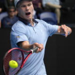 
              Jenson Brooksby of the U.S. plays a forehand return to Casper Ruud of Norway during their second round match at the Australian Open tennis championship in Melbourne, Australia, Thursday, Jan. 19, 2023. (AP Photo/Dita Alangkara)
            