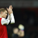 
              Arsenal's Martin Odegaard celebrates at the end of the English Premier League soccer match between Arsenal and West Ham United at Emirates stadium in London, Monday, Dec. 26, 2022. (AP Photo/David Cliff)
            