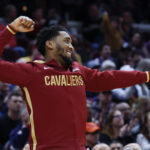 
              Cleveland Cavaliers guard Donovan Mitchell cheers from the bench during the second half of an NBA basketball game against the New Orleans Pelicans, Monday, Jan. 16, 2023, in Cleveland. (AP Photo/Ron Schwane)
            