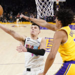 
              Miami Heat guard Tyler Herro, left, shoots as Los Angeles Lakers guard Max Christie defends during the first half of an NBA basketball game Wednesday, Jan. 4, 2023, in Los Angeles. (AP Photo/Mark J. Terrill)
            