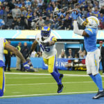 
              Los Angeles Chargers tight end Gerald Everett (7) catches a touchdown pass as Los Angeles Rams cornerback Troy Hill (2) and Bobby Wagner (45) watch during the second half of an NFL football game Sunday, Jan. 1, 2023, in Inglewood, Calif. (AP Photo/Marcio Jose Sanchez)
            