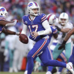 
              Buffalo Bills quarterback Josh Allen (17) runs a play during the second half of an NFL wild-card playoff football game against the Miami Dolphins, Sunday, Jan. 15, 2023, in Orchard Park, N.Y. (AP Photo/Joshua Bessex)
            