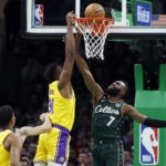 
              Boston Celtics' Jaylen Brown (7) fouls Los Angeles Lakers' Thomas Bryant (31) during the first half of an NBA basketball game, Saturday, Jan. 28, 2023, in Boston. (AP Photo/Michael Dwyer)
            