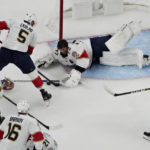 
              Florida Panthers goaltender Sergei Bobrovsky (72) attempts to cover the puck against the Vegas Golden Knights during the first period of an NHL hockey game Thursday, Jan. 12, 2023, in Las Vegas. (AP Photo/John Locher)
            