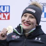 
              First placed Kaillie Humphries from the USA stands on the podium during the award ceremony  for the women's monobob Bobsleigh World Cup race in Altenberg, Germany, Saturday, Jan. 14, 2023. (Sebastian Kahnert/dpa via AP)
            