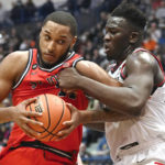 
              UConn's Adama Sanogo, right, fouls St. John's Joel Soriano in the second half of an NCAA college basketball game, Sunday, Jan. 15, 2023, in Hartford, Conn. (AP Photo/Jessica Hill)
            