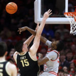 
              Ohio State center Felix Okpara, right, blocks a shot by Purdue center Zach Edey during the second half of an NCAA college basketball game in Columbus, Ohio, Thursday, Jan. 5, 2023. (AP Photo/Paul Vernon)
            
