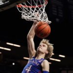 
              Kansas guard Gradey Dick dunks the ball during the first half of an NCAA college basketball game against Kansas State Tuesday, Jan. 17, 2023, in Manhattan, Kan. (AP Photo/Charlie Riedel)
            