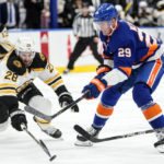 
              Boston Bruins' Derek Forbort (28) fights for control of the puck with New York Islanders' Brock Nelson (29) during the second period of an NHL hockey game Wednesday, Jan. 18, 2023, in Elmont, N.Y. (AP Photo/Frank Franklin II)
            