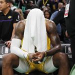 
              Los Angeles Lakers' LeBron James sits on the bench during overtime in the team's NBA basketball game against the Boston Celtics, Saturday, Jan. 28, 2023, in Boston. (AP Photo/Michael Dwyer)
            