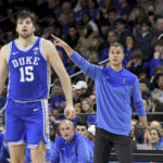 
              Duke head coach Jon Scheyer directs his team during the second half of an NCAA college basketball game against Boston College, Saturday, Jan. 7, 2023, in Boston. At left is Duke player Ryan Young (15). (AP Photo/Mark Stockwell)
            