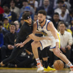 
              Brooklyn Nets guard Seth Curry defends Golden State Warriors guard Klay Thompson (11) during the first quarter of an NBA basketball game, Sunday, Jan. 22, 2023, in San Francisco. (AP Photo/D. Ross Cameron)
            