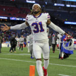 
              FILE - Buffalo Bills safety Damar Hamlin (31) celebrates a win following an NFL football game against the New England Patriots, Dec. 26, 2021, in Foxborough, Mass. Hamlin was released from a Buffalo hospital on Wednesday, Jan. 11, 2023, more than a week after he went into cardiac arrest and had to be resuscitated during a game at Cincinnati, after his doctors said they completed a series of tests. (AP Photo/Stew Milne, File)
            