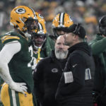 
              Green Bay Packers head coach Matt LaFleur talks to linebacker Quay Walker, left, after Walker was ejected during the second half of an NFL football game against the Detroit Lions Sunday, Jan. 8, 2023, in Green Bay, Wis. (AP Photo/Morry Gash)
            
