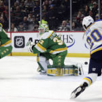 
              Minnesota Wild goaltender Filip Gustavsson (32) watches St. Louis Blues left wing Brandon Saad (20) shoot the puck during the first period of an NHL hockey game Sunday, Jan. 8, 2023, in St. Paul, Minn. (AP Photo/Stacy Bengs)
            