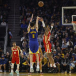 
              Golden State Warriors guard Klay Thompson (11) shoots over Atlanta Hawks forward John Collins, right, during the first half of an NBA basketball game in San Francisco, Monday, Jan. 2, 2023. (AP Photo/Jed Jacobsohn)
            