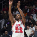 
              Miami Heat forward Jimmy Butler shoots a 3-point basket during the second half of an NBA basketball game against the Atlanta Hawks, Monday, Jan. 16, 2023, in Atlanta. (AP Photo/Hakim Wright Sr.)
            