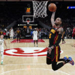 
              Atlanta Hawks guard Dejounte Murray scores against the Milwaukee Bucks during the first half of an NBA basketball game Wednesday, Jan. 11, 2023, in Atlanta. (AP Photo/John Bazemore)
            